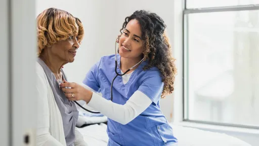 ADN checks patient vitals.