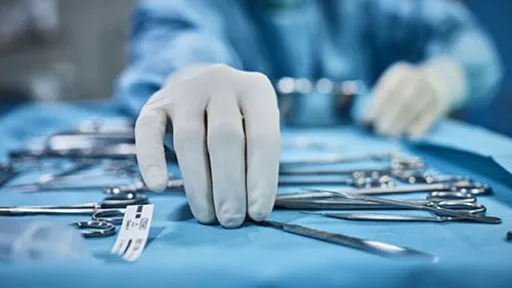 Surgical Technologist sorting instruments on an instrument tray.
