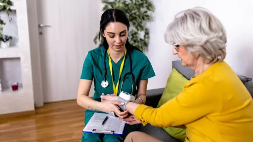 Medical assistant taking patient’s blood pressure, showing potential for career growth in allied health care.