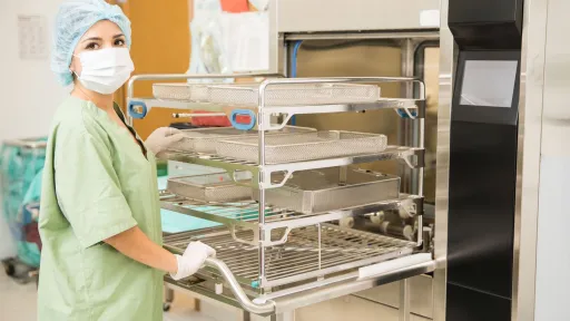 Sterile processing technician preparing instrument trays for sterilization, highlighting certification pathways