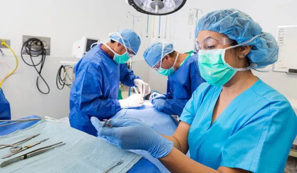 surgical tech retrieving an instrument for a surgeon