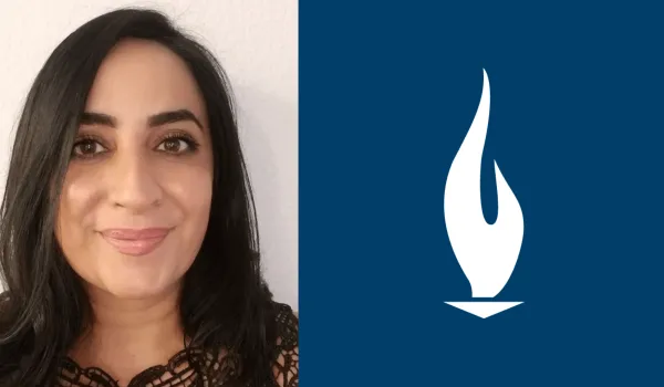 elham-danucalov-with-black-hair-smiles-for-camera