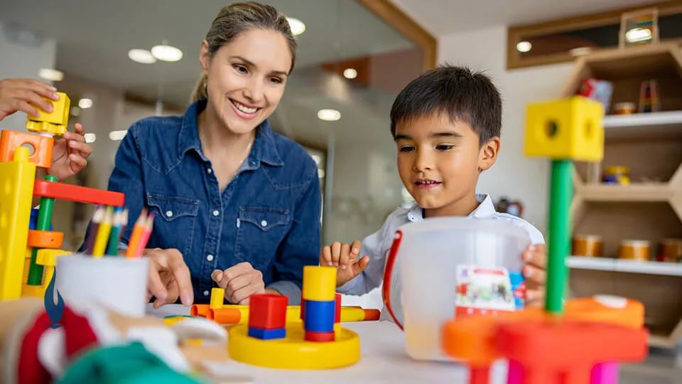 OTA working with boy in school OTA working with boy in school