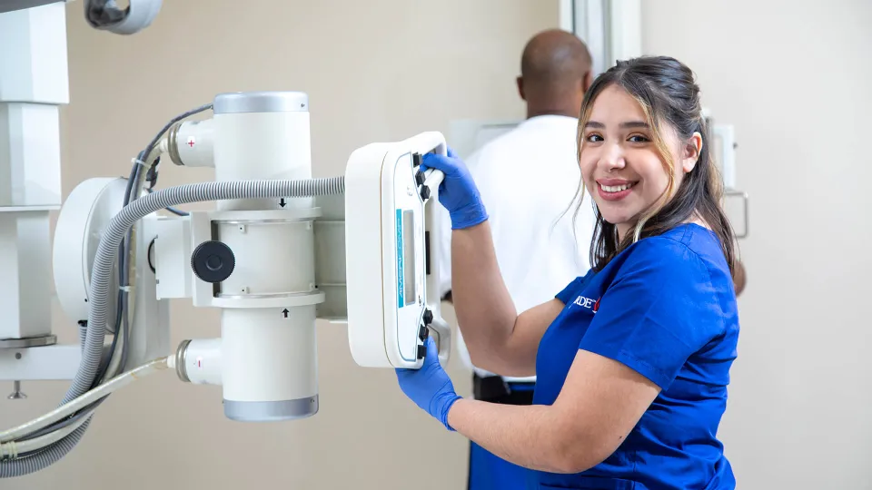 Radiologic Tech demonstrating skills at x-ray machine. Radiologic Tech demonstrating skills at x-ray machine.