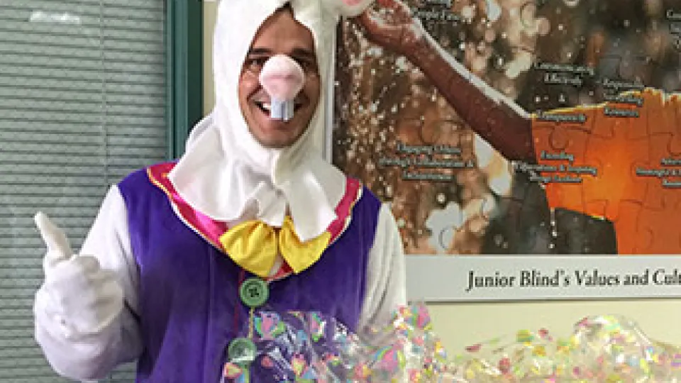 Student volunteers time as Easter bunny delivering Easter baskets.