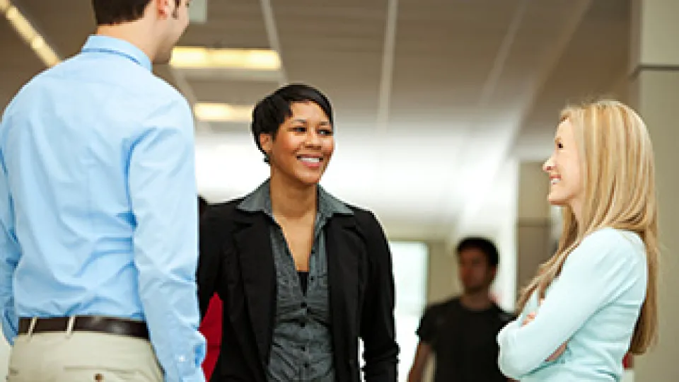 Career-Blog Professionals standing and talking.