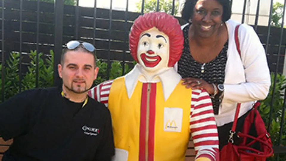 Two students from Concorde's Dallas campus pose with Ronald McDonald.