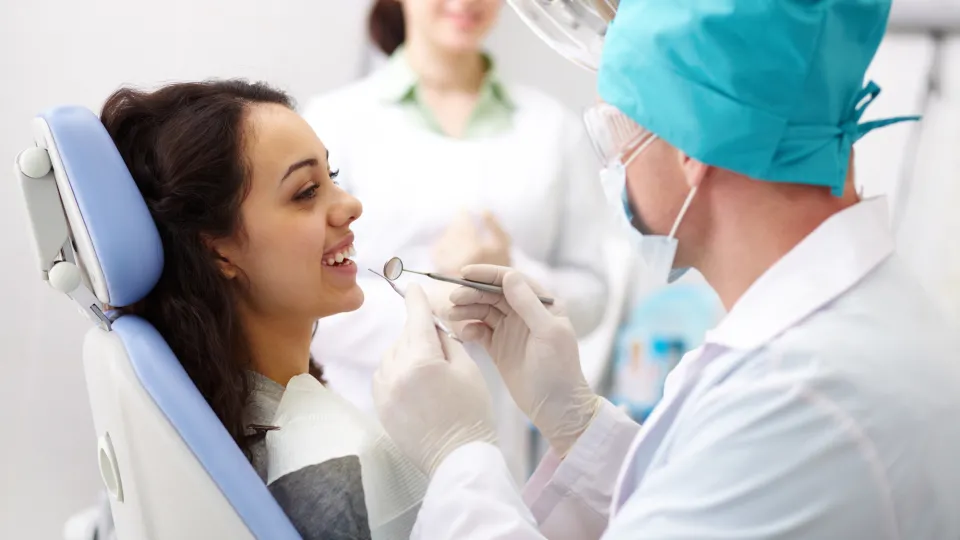 Smiley patient dental hygienists