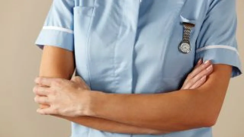 nurse with lapel watch