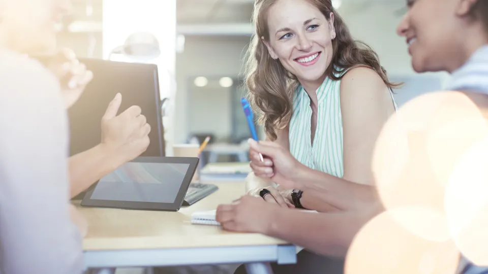 Unposed group of creative business people in an open concept office brainstorming their next project. health care professional development