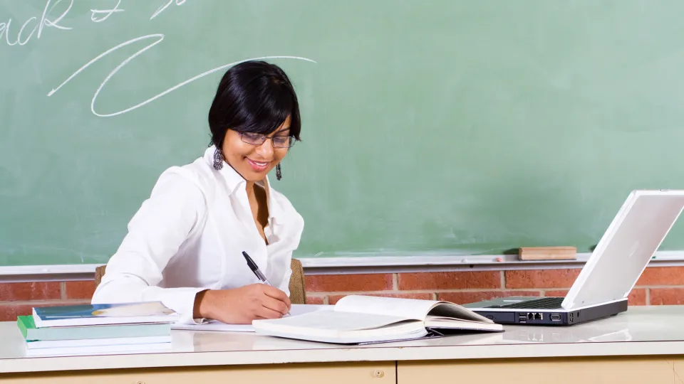 young female school teacher preparing class health care programs