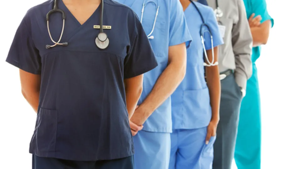 health professionals in scrubs stethoscopes