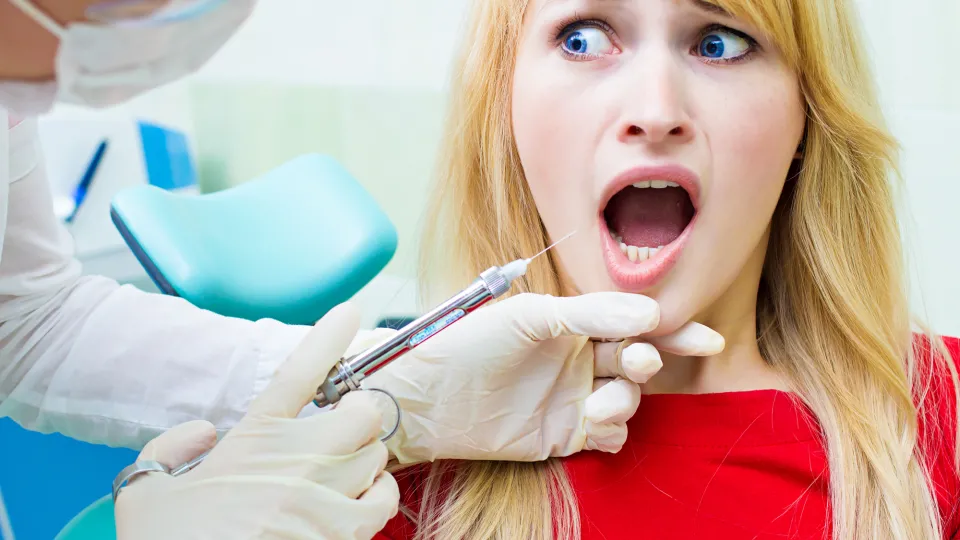 Young patient in dentist office, afraid of anesthetic injection, Young patient in dentist office, afraid of anesthetic injection,