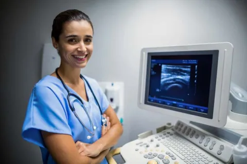 Nurse using ultrasonic monitor